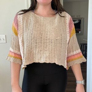 Boutique knit sweater with multicolored sleeves